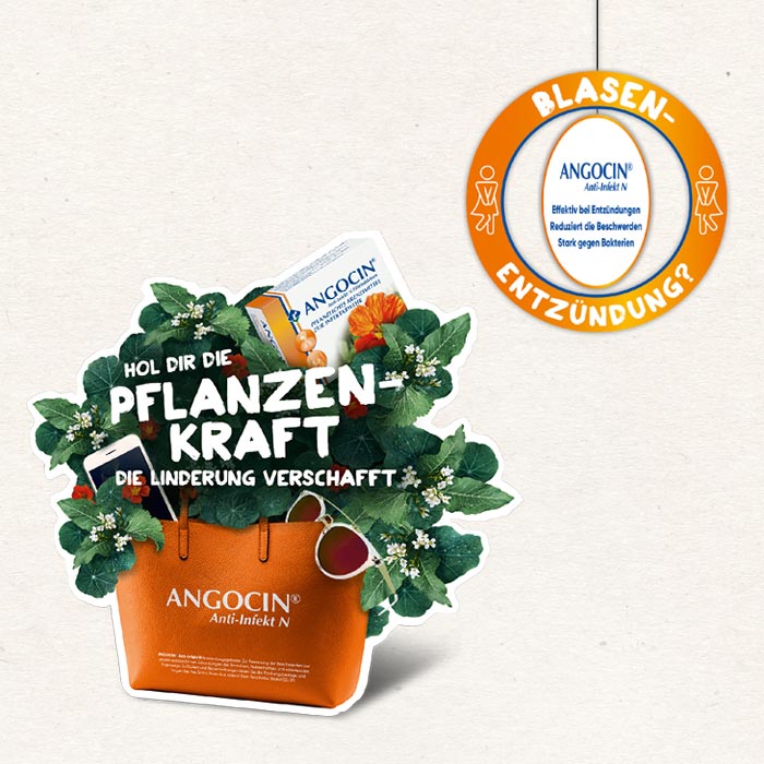 Werbeanzeige für Angocin mit einer Tasche aus der Blumen kommen und dem 'Slogan Pflanzen Kraft'